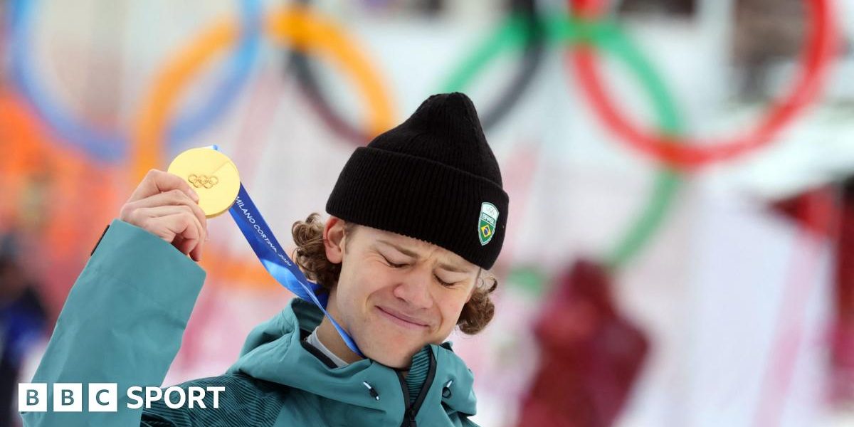 Lucas Pinheiro Braathen holds up his Olympic gold medal