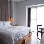 hotel-bedroom-with-double-bed-table-tv-set-scaled.jpg - NewsFactor